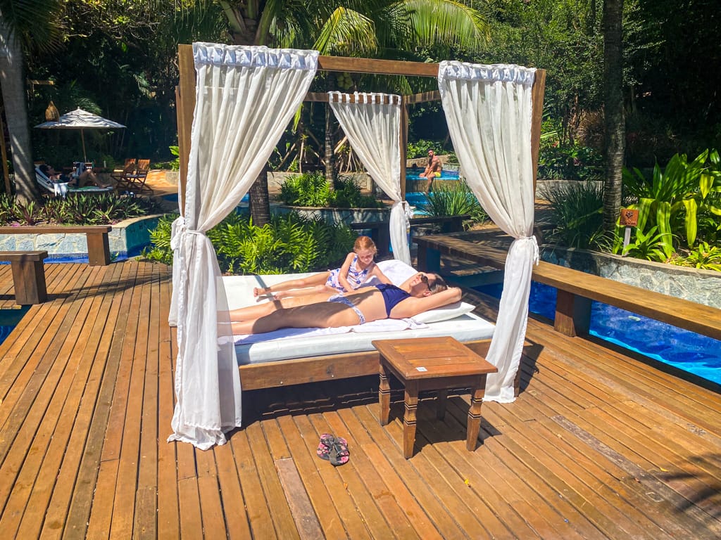 a child and woman in a cabana