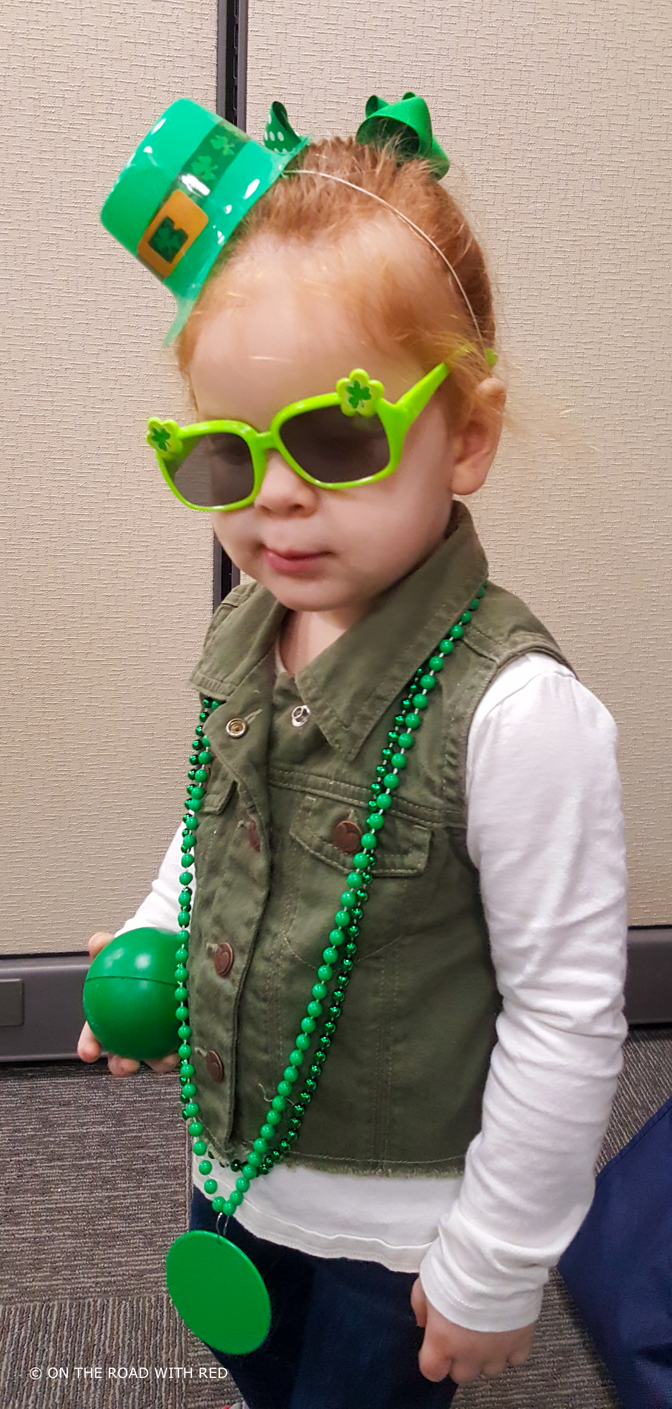 a toddler in st. patricks attire