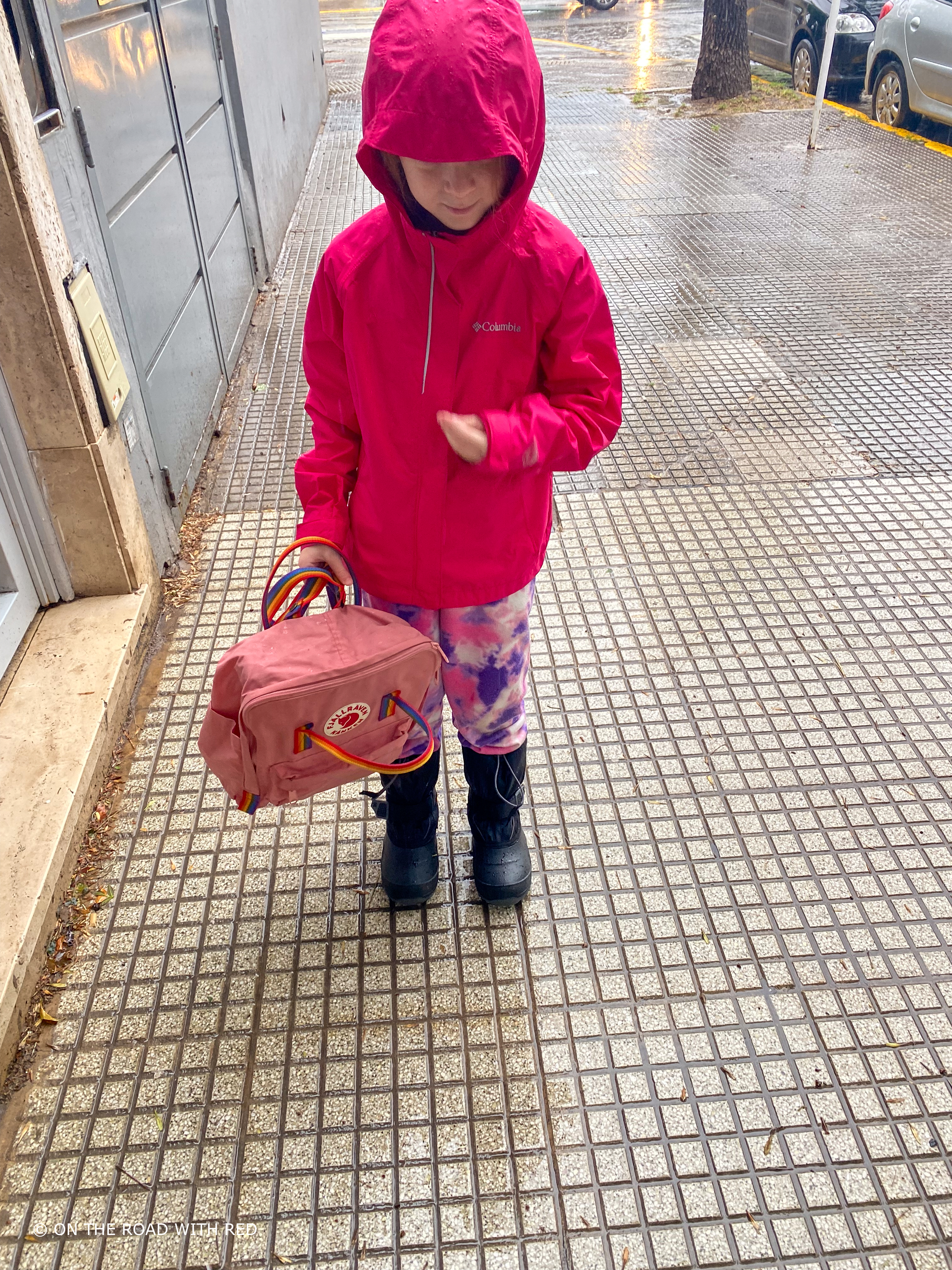 a child walking in the rain