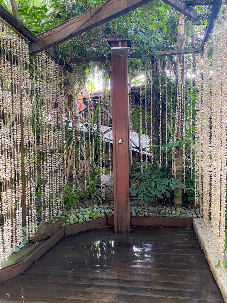 a outdoor shower with a shell curtain