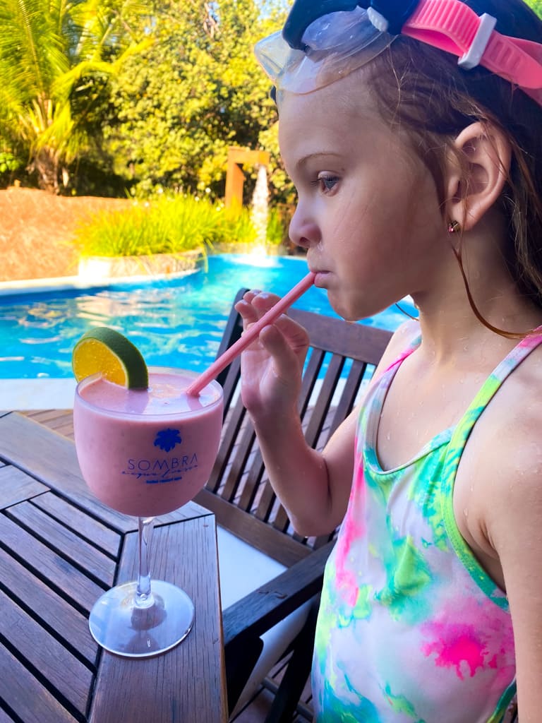 a child sipping a tropical drink