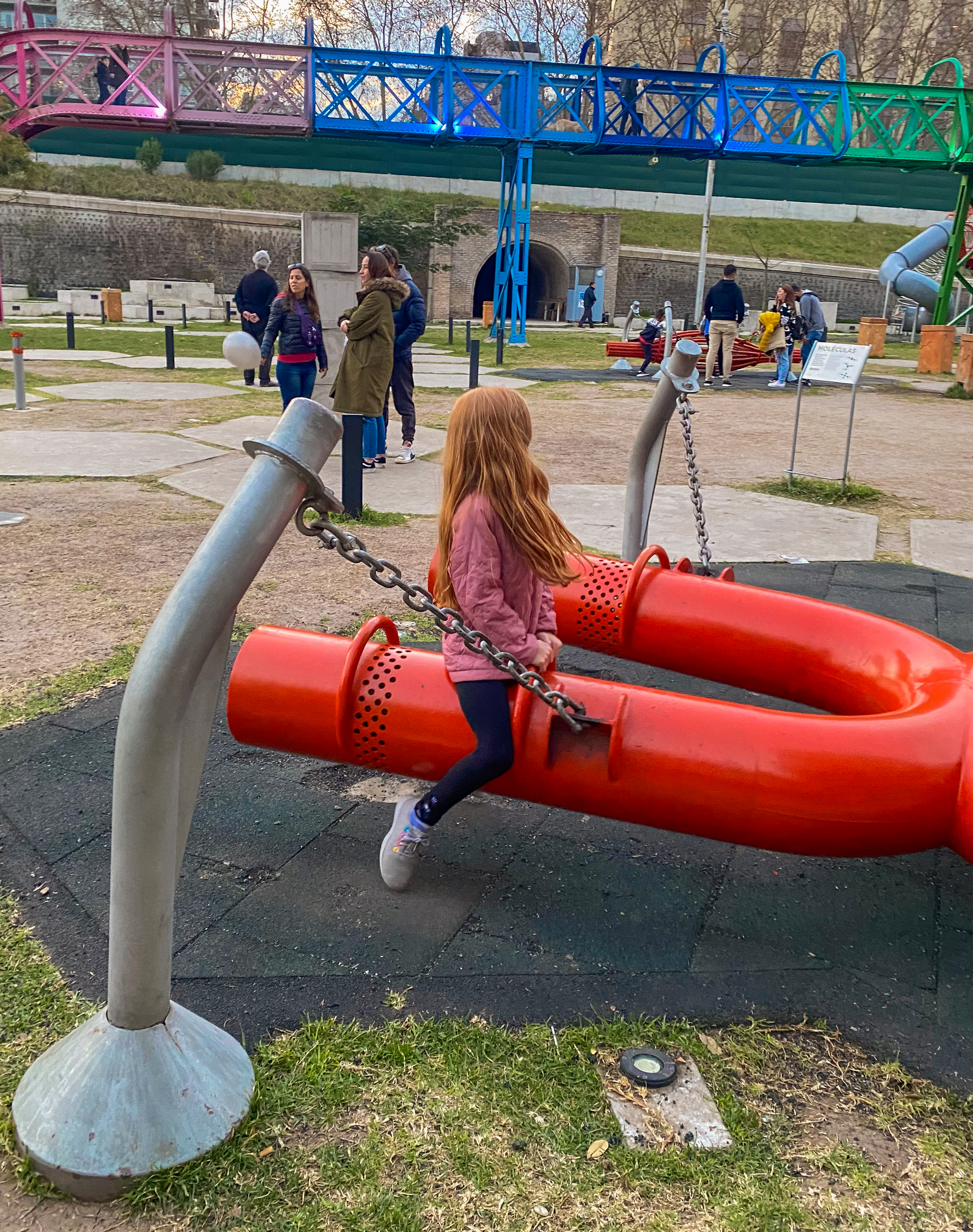 child playing on playground equipment