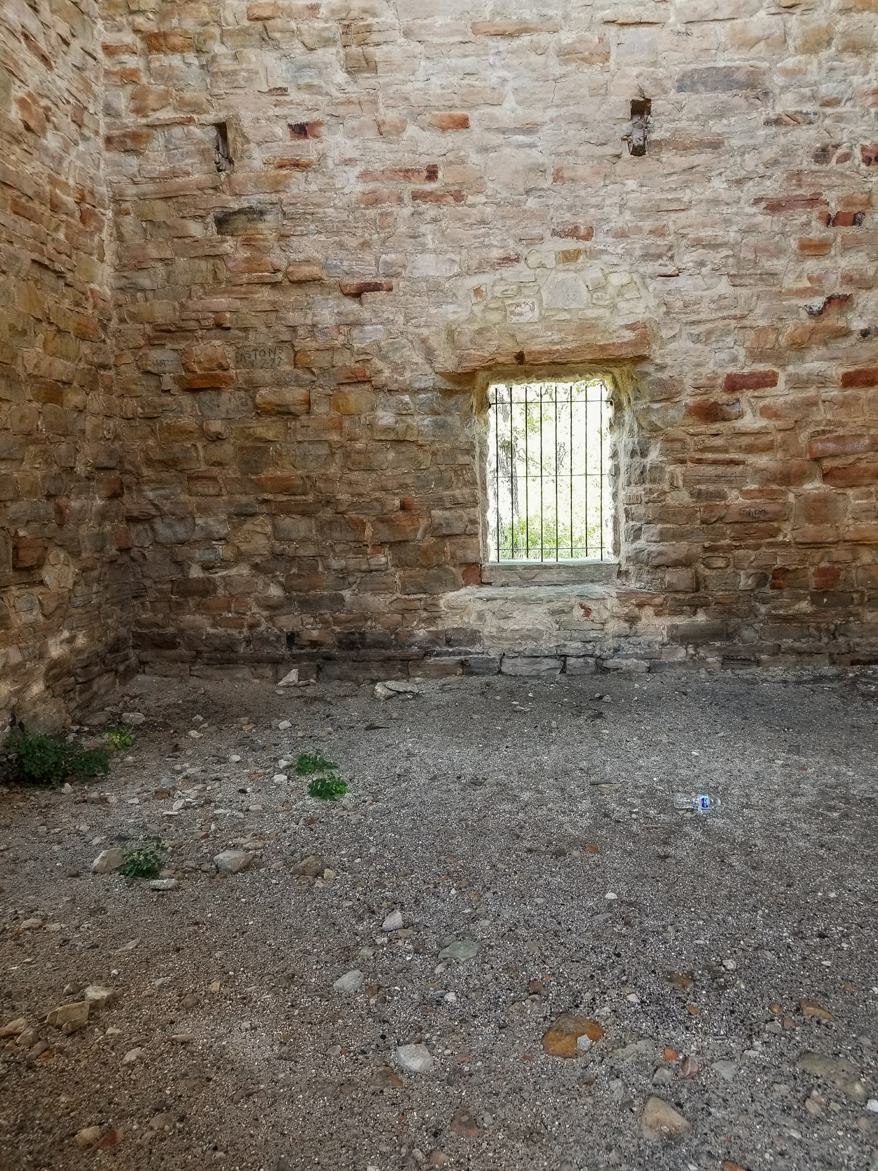 looking into the back of stone ruins.