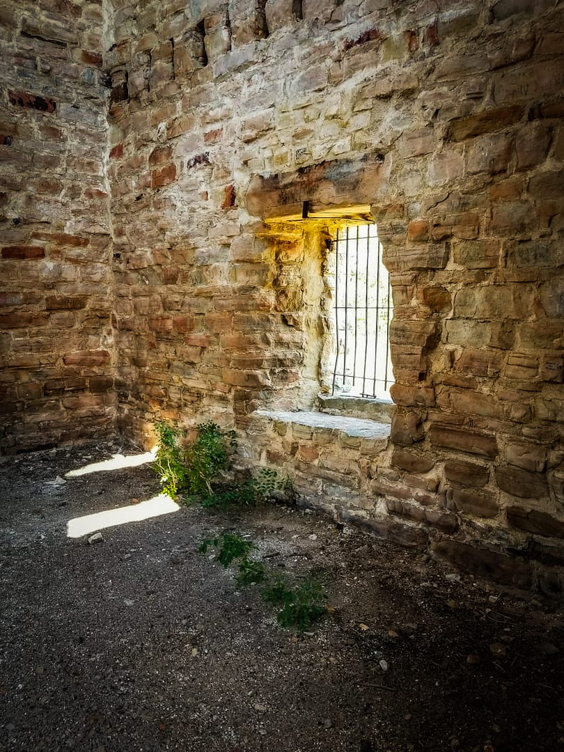 a dimly lit stone ruin