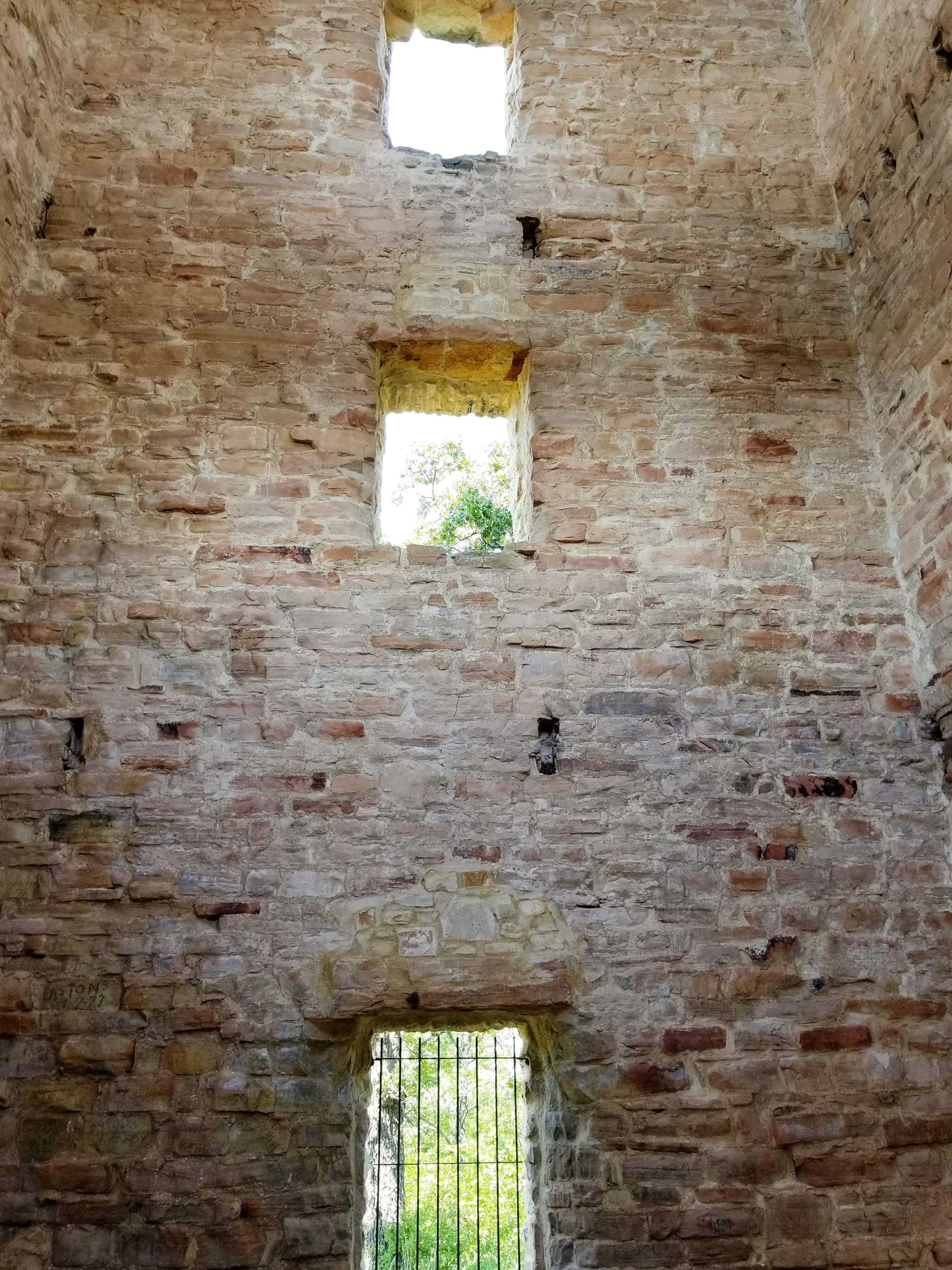looking up inside stone ruins.