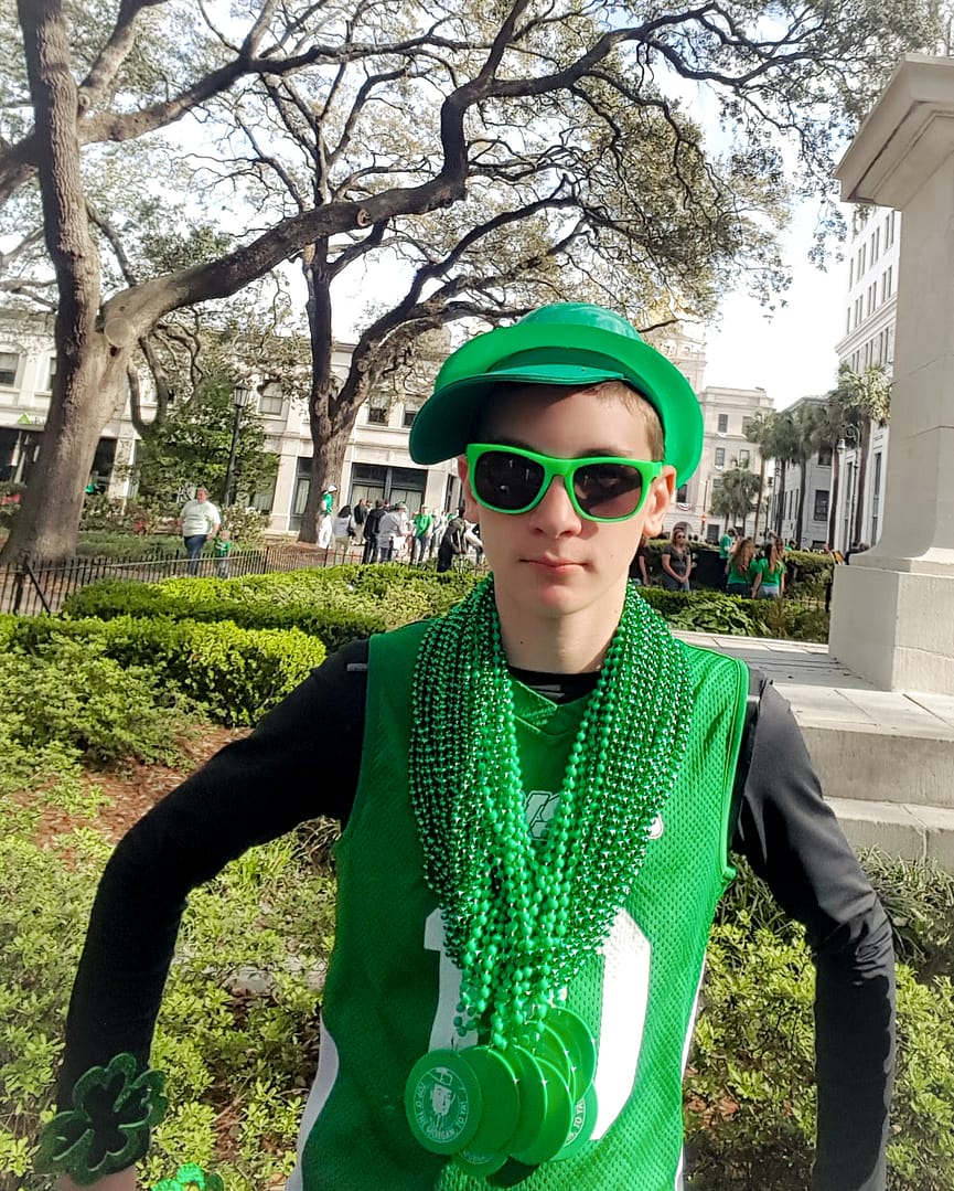 a boy with green st. patricks day attire